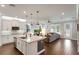 Spacious kitchen with stainless steel appliances, granite countertops, and an island with seating at 10072 Hampshire Oaks Dr, Orlando, FL 32825