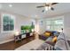 Inviting living room featuring hardwood floors and a comfortable sectional sofa at 10072 Hampshire Oaks Dr, Orlando, FL 32825