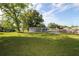 Home's backyard featuring a large green yard at 1016 E Fillmore Ave, Orlando, FL 32809