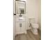 Modern bathroom features a new vanity and commode at 1016 E Fillmore Ave, Orlando, FL 32809