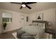 Cozy bedroom with a ceiling fan, plank floors, and a window for natural light at 1016 E Fillmore Ave, Orlando, FL 32809