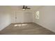 Bright bedroom with new flooring, a ceiling fan, and ample closet space at 1016 E Fillmore Ave, Orlando, FL 32809