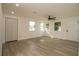 Bright living room featuring lots of natural light and plank flooring at 1016 E Fillmore Ave, Orlando, FL 32809
