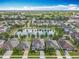 Overhead view displaying the homes surrounding the waterway, neighborhood, and manicured landscaping at 1078 Vinsetta Cir, Winter Garden, FL 34787