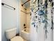 Full bathtub and shower with patterned shower curtain at 1078 Vinsetta Cir, Winter Garden, FL 34787