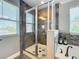 Modern bathroom boasts a glass-enclosed shower with decorative tile and a separate soaking tub at 1078 Vinsetta Cir, Winter Garden, FL 34787