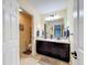 Bathroom featuring double vanity, granite countertops, and stylish fixtures at 1078 Vinsetta Cir, Winter Garden, FL 34787