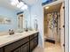 Bathroom with double vanity and access to the shower at 1078 Vinsetta Cir, Winter Garden, FL 34787