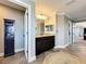 Bathroom showcasing a dark wood vanity with granite top and decorative mirror lighting at 1078 Vinsetta Cir, Winter Garden, FL 34787