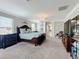 Spacious bedroom with large bed and overhead lighting at 1078 Vinsetta Cir, Winter Garden, FL 34787