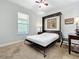 Neutral bedroom with a murphy bed, ceiling fan, neutral carpet, and a window with blinds at 1078 Vinsetta Cir, Winter Garden, FL 34787