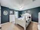 Bedroom featuring an accent wall and a comfortable bed at 1078 Vinsetta Cir, Winter Garden, FL 34787