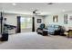 Spacious bonus room filled with natural light, boasting a plush seating area and playful Star Wars pinball machine at 1078 Vinsetta Cir, Winter Garden, FL 34787