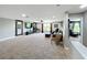 Expansive bonus room featuring neutral carpet, entertainment center, and comfortable seating area with bright natural light at 1078 Vinsetta Cir, Winter Garden, FL 34787
