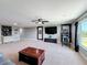 Open bonus room showcasing a mounted TV, coffee station, and plenty of space for various activities at 1078 Vinsetta Cir, Winter Garden, FL 34787