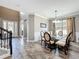 Dining area adjacent to the home's foyer and featuring lots of natural light at 1078 Vinsetta Cir, Winter Garden, FL 34787