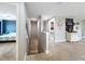 Hallway with carpeted stairs leading to a bedroom and coffee bar area at 1078 Vinsetta Cir, Winter Garden, FL 34787