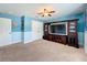 Comfortable living room space with television and doors at 1078 Vinsetta Cir, Winter Garden, FL 34787