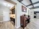 Home office featuring built-in desks, dark cabinets, and ample workspace at 1078 Vinsetta Cir, Winter Garden, FL 34787