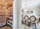 Pantry shelving next to a dining area with table and chairs and decorative lighting at 1078 Vinsetta Cir, Winter Garden, FL 34787