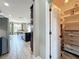 Walk-in pantry with shelving adjacent to a well-appointed kitchen and dining area at 1078 Vinsetta Cir, Winter Garden, FL 34787