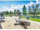 Charming patio featuring a fire pit with seating, offering a relaxing outdoor space at 1078 Vinsetta Cir, Winter Garden, FL 34787