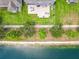 Aerial view showcasing the home's backyard, the pond, and nearby walking path and landscaping at 1078 Vinsetta Cir, Winter Garden, FL 34787