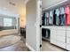 View from closet to bathroom with soaking tub, shower, and granite countertop vanity at 1078 Vinsetta Cir, Winter Garden, FL 34787