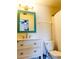 Bathroom features a white vanity with framed mirror and updated fixtures at 110 S Primrose Dr, Orlando, FL 32803