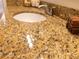 Close-up of bathroom vanity featuring a granite countertop and modern faucet at 110 S Primrose Dr, Orlando, FL 32803