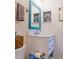Bathroom featuring a white vanity with a blue-framed mirror and accent wall with mosaic tile at 110 S Primrose Dr, Orlando, FL 32803