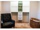 Walk-in closet with built-in shelving and drawers, accented with palm leaf wallpaper at 110 S Primrose Dr, Orlando, FL 32803