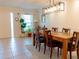 Bright dining room with decorative wainscoting, stylish lighting, and tile flooring at 110 S Primrose Dr, Orlando, FL 32803