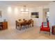 Bright dining room with decorative wainscoting, stylish lighting, and tile flooring at 110 S Primrose Dr, Orlando, FL 32803