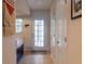 Home entryway features front door with sidelights and tile flooring at 110 S Primrose Dr, Orlando, FL 32803