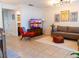 Cozy living room with modern furnishings, neutral tones, and tile flooring at 110 S Primrose Dr, Orlando, FL 32803
