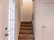 Carpeted stairway with white trim, leading to upper level at 110 S Primrose Dr, Orlando, FL 32803