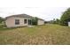 Backyard shot showing the exterior of the home and lawn at 1139 Humphrey Blvd, Deltona, FL 32738