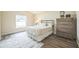 Cozy bedroom with neutral tones, wood flooring, and a comfy bed at 1139 Humphrey Blvd, Deltona, FL 32738
