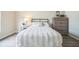 Stylishly staged bedroom boasts fresh decor and hardwood floors at 1139 Humphrey Blvd, Deltona, FL 32738
