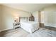 A bedroom featuring neutral tones, wood flooring, and comfortable furnishings at 1139 Humphrey Blvd, Deltona, FL 32738