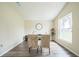 Cozy dining room featuring hardwood floors, neutral walls, and a large window at 1139 Humphrey Blvd, Deltona, FL 32738