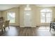 Bright entryway with hardwood floors, a front door with glass accents, and neutral walls at 1139 Humphrey Blvd, Deltona, FL 32738