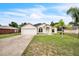 Inviting single-story home with a well-kept lawn, mature trees, and attached two-car garage at 1139 Humphrey Blvd, Deltona, FL 32738