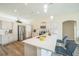 Well-lit kitchen featuring a large island, stainless appliances and white cabinetry at 1139 Humphrey Blvd, Deltona, FL 32738