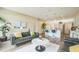 Bright living room open to kitchen, with modern furnishings and wood flooring at 1139 Humphrey Blvd, Deltona, FL 32738
