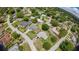 An aerial shot capturing a suburban neighborhood, lined with mature trees at 119 Ridgecrest Dr, Eustis, FL 32726