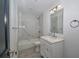 Modern bathroom with marble tile, updated vanity, and chrome fixtures at 119 Ridgecrest Dr, Eustis, FL 32726