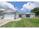 Charming single-story home boasting a well-maintained lawn and a two-car garage at 119 Ridgecrest Dr, Eustis, FL 32726