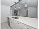 Modern kitchen island with quartz countertop, stainless steel appliances, and pendant lighting at 119 Ridgecrest Dr, Eustis, FL 32726